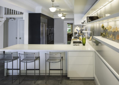 Custom Home Builder - Modern - new renovation - chrome chairs - white drawers - refrigerator -